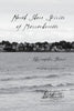 Black-and-white cover with cursive “North Shore Spirits of Massachusetts,” featuring waves and shoreline houses. Explore Salem ghosts and North Shore paranormal stories. Author and Schiffer Publishing, Ltd. listed.
