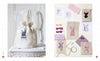 A cream drawstring bag with embroidered lingerie rests on a white chair. Nearby are fabric swatches, sketches, and canvases from Schiffer Publishing, Ltd.’s Retro Cross Stitch collection in vintage purple and pink patterns.