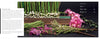 Perishable Poetics" by Schiffer Publishing, Ltd. lies open, pages edged in green florals and pearls. Pink and purple blooms with greenery are arranged in front, offering floral inspiration. The contents page appears on the right.