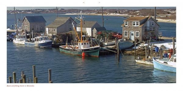 A tranquil harbor scene from Martha's Vineyard, featuring fishing boats and rustic wooden buildings by the calm bay under a clear sky, as captured in classic photography from Schiffer Publishing, Ltd.