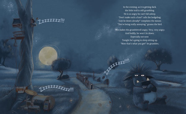 A grumpy badger sits under a tree at night with crossed arms, unable to sleep. The moon glows while Zzzzzzz!!! drifts from a house nearby. Inspired by The Grumbletroll from Schiffer Publishing, Ltd., text appears on the right in this blue-toned scene.