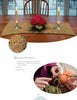 A wooden dining table with a crocheted runner, candles, and red flowers sets the scene, while a close-up of hands crocheting with green yarn and a red hook offers perfect inspiration for Schiffer Publishing's "Basic Knitting and Crocheting for Today's Woman.
