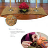 A wooden dining table with a crocheted runner, candles, and red flowers sets the scene, while a close-up of hands crocheting with green yarn and a red hook offers perfect inspiration for Schiffer Publishing's "Basic Knitting and Crocheting for Today's Woman.