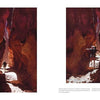 Two hikers trek through a sunlit red rock canyon, shadows cast on the path—an iconic scene from "In the Chasms of Water, Stone, and Light" by Schiffer Publishing, Ltd., capturing the dramatic beauty of the American Southwest.