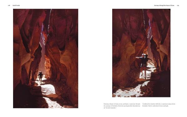Two hikers trek through a sunlit red rock canyon, shadows cast on the path—an iconic scene from "In the Chasms of Water, Stone, and Light" by Schiffer Publishing, Ltd., capturing the dramatic beauty of the American Southwest.