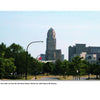 “Greetings from Buffalo, New York” by Schiffer Publishing, Ltd. showcases a vibrant cityscape with a historic building at the center, surrounded by modern architecture and greenery beneath a clear blue sky—illustrating Buffalo’s timeless charm.