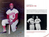 A Black player in a Travelers uniform kneels with a bat. The next page of "Dick Allen, The Life and Times of a Baseball Immortal" (Schiffer Publishing, Ltd.) features a chapter title, a biography excerpt, and a photo of two Phillies shaking hands.