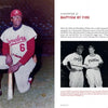 A Black player in a Travelers uniform kneels with a bat. The next page of "Dick Allen, The Life and Times of a Baseball Immortal" (Schiffer Publishing, Ltd.) features a chapter title, a biography excerpt, and a photo of two Phillies shaking hands.