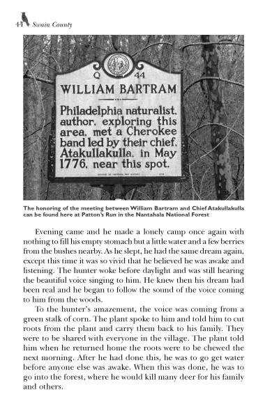 A historical marker in Nantahala National Forest honors naturalist William Bartram’s meeting with Cherokee Chief Atakullakulla—echoing themes from "Appalachia Mountain Folklore" by Schiffer Publishing, Ltd.—standing quietly in a wooded area.
