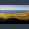Art from above Cape Cod" by Schiffer Publishing, Ltd. showcases a panoramic aerial view of the Cape, with grassy land, sandy shores, and tidal flats stretching between shimmering waters beneath clear skies—a breathtaking drone photograph.
