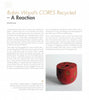 A magazine page spotlights “Robin Wood's CORES Recycled” by Schiffer Publishing, Ltd., with an article on unique recycled wood art and a photo of a small red round box with yellow and black circles.