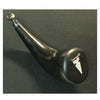 The Powder Horns by Schiffer Publishing, Ltd. features a smooth, curved black body with a round stopper and an inlaid arrowhead shape on the wide end—a fine example of powder horn making—displayed on a dark surface.