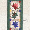 The "Quilts of Chestnut Ridge" by Schiffer Publishing, Ltd. is a rectangular quilted wall hanging or runner with three patchwork maple leaves in red, green, and blue on a light background and green border—great for autumn décor.