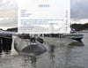 Two Los Angeles class submarines dock at a pier with people aboard, set against water and hills. A transparent table of contents for "The US Navy's Fast Attack Submarines, Vol.1" by Schiffer Publishing, Ltd. overlays the top of the image.