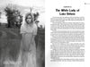 A grayscale image: a worried young woman in a white nightgown stands in tall grass before an old house—an eerie scene from Schiffer Publishing, Ltd.'s Campfire Tales Great Lakes inspired by "The White Lady of Lake Ontario" ghost story.
