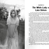 A grayscale image: a worried young woman in a white nightgown stands in tall grass before an old house—an eerie scene from Schiffer Publishing, Ltd.'s Campfire Tales Great Lakes inspired by "The White Lady of Lake Ontario" ghost story.