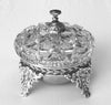 The book "American Glass Bells" by Schiffer Publishing, Ltd. is perfect for glass enthusiasts and collectors, offering detailed insights and images of decorative glass bells, ideal as a display piece on any plain surface.