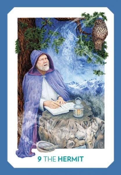 An elderly man in a purple cloak writes by lantern light on a stone table at night, a brown owl above and mountains shining—evoking the mystical imagery of the Gaian Tarot by Schiffer Publishing, Ltd.