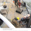 Two crew members in safety gear use chains and a crane to lift ice aboard a seafood boat on the Chesapeake Bay, surrounded by yellow ropes and equipment. Photo from "Chesapeake Men" by Schiffer Publishing, Ltd.