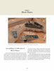 Three wooden hand planes and one metal block plane sit on a workbench above an open copy of "Hand Planes in the Modern Shop" by Schiffer Publishing, Ltd.; the wooden planes differ in size and style.