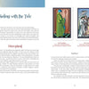 A book spread from "Tarot for the Fiction Writer" by Schiffer Publishing, Ltd. displays Tarot cards and text. The left page has “Sailing with the Tide” and “Hierophant” in red, while the right shows Hierophant and Lovers cards for inspiration.