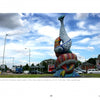 Mosaic Art Today by Schiffer Publishing, Ltd. features vibrant contemporary mosaic sculptures—like two intertwined fish crafted from colorful tesserae, displayed under a partly cloudy sky at a city roundabout.