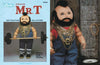 I Pity the Dolls" by Schiffer Publishing, Ltd. is a soft sculpture folk art doll inspired by Mr. T—standing upright with a mohawk, overalls, sneakers, gold chains, and barbell—crafted after a Martha Holcombe pattern for collectors and fans.