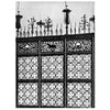 Black and white photo of ornate iron gates with animal and floral motifs, candleholders, and spikes, highlighting masterful design. From "Decorative Ironwork of Italy" by Schiffer Publishing, Ltd. Caption: Siena - Cappella del Palazzo Pubblico.