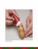 A hand displays a Santa holiday gourd ornament featured in "Making More Gourd Ornaments" by Schiffer Publishing, Ltd.—a festive piece with a red hat, glasses, and beard to enhance your unique holiday décor.