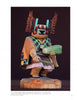 The Hopi Kachinas by Schiffer Publishing, Ltd. features a wooden doll adorned with a detailed mask, vibrant attire, feathers, and accessories like a corn cob and rattle, standing on a wooden base against a dark background.