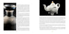 A two-page spread from The Art of Kintsugi by Schiffer Publishing, Ltd. shows a dark ceramic vase (left), a white elephant teapot (right), and text about Japanese repair art flowing around the images.