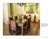Colores: Mexican Interiors by Schiffer Publishing, Ltd. showcases vibrant Mexican homes with glass-topped tables, wooden chairs with bright cushions, and framed tree art, all brought together by warm, earthy colors in inviting dining rooms.