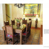 Colores: Mexican Interiors by Schiffer Publishing, Ltd. showcases vibrant Mexican homes with glass-topped tables, wooden chairs with bright cushions, and framed tree art, all brought together by warm, earthy colors in inviting dining rooms.
