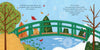Inspired by Claude Monet's Giverny garden, "A Colorful Tail" by Schiffer Publishing, Ltd. shows a green bridge over a pond—fall leaves on the left, snowy winter on the right, and a fox by the frozen water—ideal for a children's book.