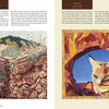 A two-page spread from "Inspired by the National Parks" by Schiffer Publishing, Ltd. displays a layered landscape with a green lizard and desert plants on the left, and a vibrant quilted bobcat portrait on the right—both nature-inspired art quilts.