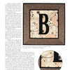 The “Inspired by the Beatles” wall hanging from Schiffer Publishing, Ltd. features a bold black B on a beige floral background with a dark brown border, showcasing intricate stitching—an ideal keepsake for Beatles fans.