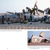 Soldiers examine the wreckage of Lady Be Good, a WWII bomber, in the Libyan Desert—its remains partly buried in sand. Discover more in "No Way Out" by Schiffer Publishing, Ltd.