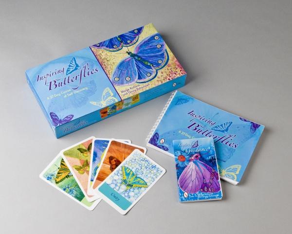 Inspiring Butterflies by Schiffer Publishing, Ltd. is a boxed set featuring a blue butterfly design, a guidebook, a self-discovery workbook, and colorful butterfly cards, all displayed on a light gray surface.