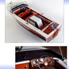 Fundamentals of Model Boat Building by Schiffer Publishing, Ltd. details creating vintage wooden motorboats with white trim, red seats, chrome accents, and classic dashboards featuring gauges, steering wheels, and wood paneling.
