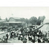 A crowd in early 20th-century attire waits near a dock for the excursion boat Colonial at Belle Isle, evoking vintage postcards from "Colonial Beach, Virginia" by Schiffer Publishing, Ltd., with a building and trees in the background.