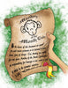 A hand holds a "Monkey of the Month" scroll by Schiffer Publishing, Ltd., featuring a cartoon monkey and yellow seal—an ideal birthday gift—against a textured green background.