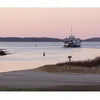 Capture the serene beauty of Martha's Vineyard with Schiffer Publishing, Ltd.—a white lighthouse at sunset, a ferry gliding through calm waters, distant land on the horizon, and a pastel pink sky.