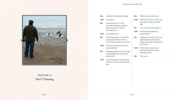 On a sandy Devon beach, someone watches two surfers and Nell, a black Labrador, head for the waves. The left page of "Conversations with Nell" by Schiffer Publishing, Ltd. reads "Chapter 18: Surf Chasing"; the right has script-style dialogue.