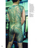 A man displays an intricate Japanese dragon tattoo on his back and thighs, reminiscent of Horiyoshi III’s legendary style as featured in “Studying Horiyoshi III” from Schiffer Publishing, Ltd.