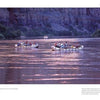 Three inflatable rafts drift along the calm Colorado River at sunset, canyon walls aglow, as captured in "In the Chasms of Water, Stone, and Light" from Schiffer Publishing, Ltd.—a serene Grand Canyon scene.