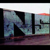 The "Miami Graffiti Art" by Schiffer Publishing, Ltd. shows bold black letters spelling INSIST on a long blue-gray wall, set against faint graffiti and urban Miami scenery reflecting on a wet street.