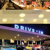 Featured in the book "Southern California Eats 2" by Schiffer Publishing, Ltd., this scene captures a retro diner with red booths and classic counter, vintage cars outside, and a neon DRIVE-IN sign—an iconic Los Angeles landmark.