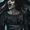 A ghostly woman with long black hair screams, her mouth agape. She clutches an oracle card from The Witch’s Oracle, 2nd Edition by Schiffer Publishing, Ltd., with "Banshee" written at the bottom of the eerie, dark-toned image.