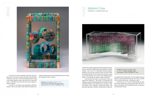 Two pages from Schiffer Publishing's "Dimensional Cloth" display vibrant glass sculptures themed after fiber art: a tall, rectangular work with swirling orbs on the left, and a layered, forest-like piece with artist info on the right.