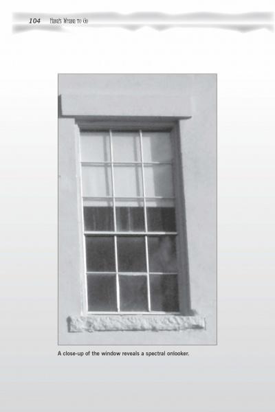 A black-and-white photo from Scare-izona by Schiffer Publishing, Ltd. shows a window with multiple panes; a blurry shape in the bottom left appears to be a ghostly face, evoking classic ghost stories and paranormal intrigue.